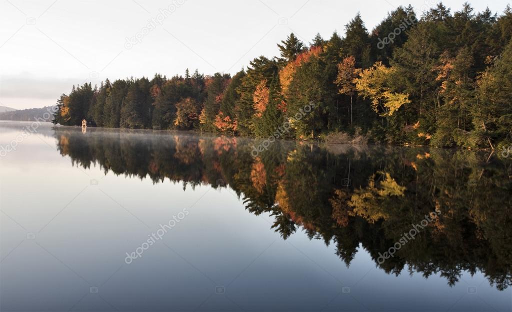Lake in Autumn sunrise reflection