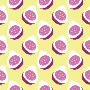 İncir ikiye bölünmüş, sarı arka planda pürüzsüz bir desen var..