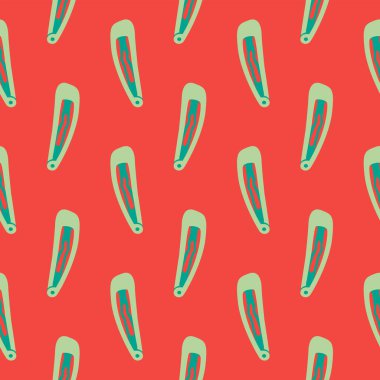 Kırmızı arka planda küçük saç tokası, pürüzsüz desen..