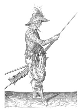 Bir asker, tam uzunlukta, sağ tarafta, sol kalçasıyla bir tüfek (özel bir tür ateşli silah) tutuyor ve sağ elini ramrod, vintage gravür çalıştırmak için kullanıyor..