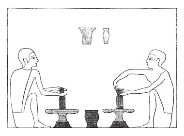 Two potters shaping an article on the wheel, vintage engraving.