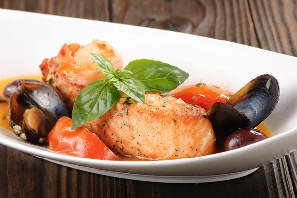 Braised salmon steak with seafood — Stock Photo, Image