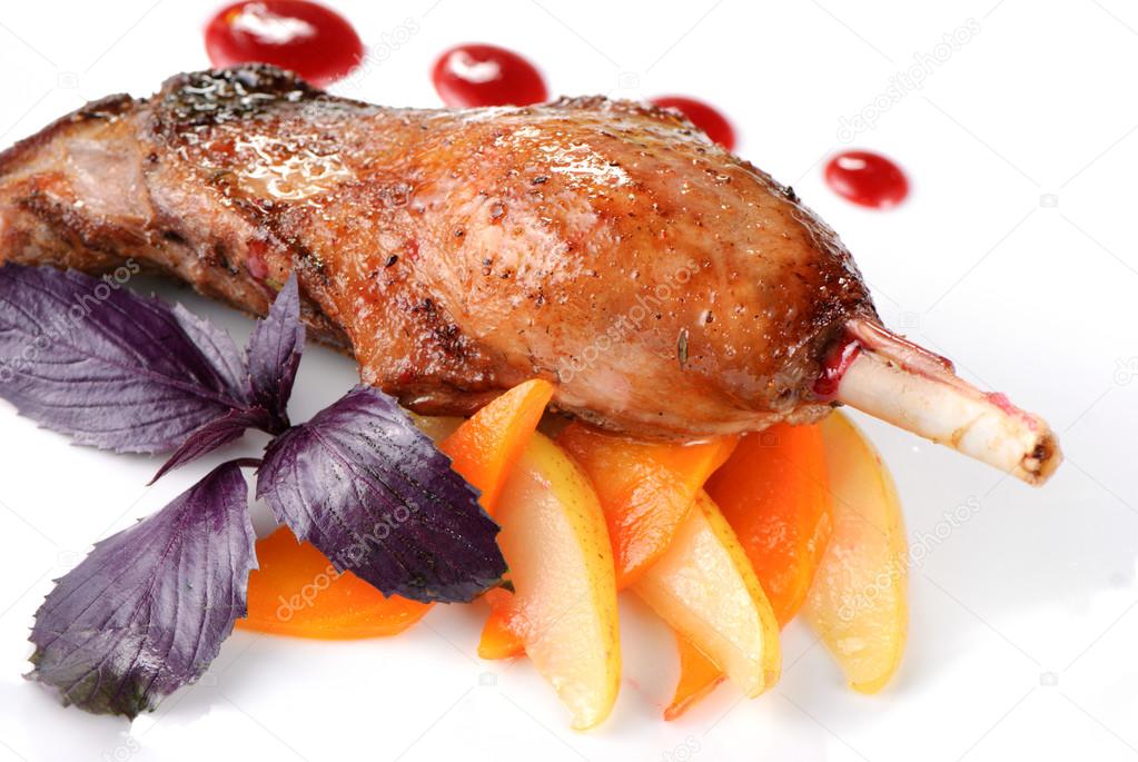 Baked goose leg with pear