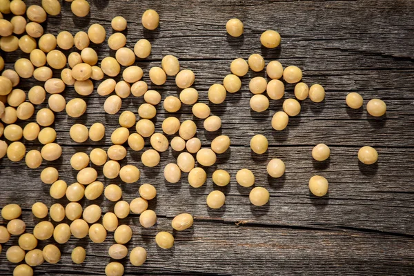 Close-up of soybean on wood background. — Stock Photo, Image