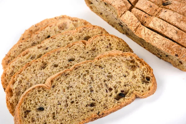 Sliced ketogenic bread made of oatmeal and coconut flour on a white background — Stock Photo, Image