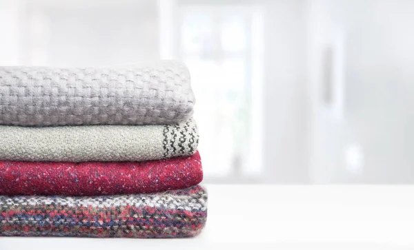 Stack Knitted Warm Scarves White Table Stock Photo