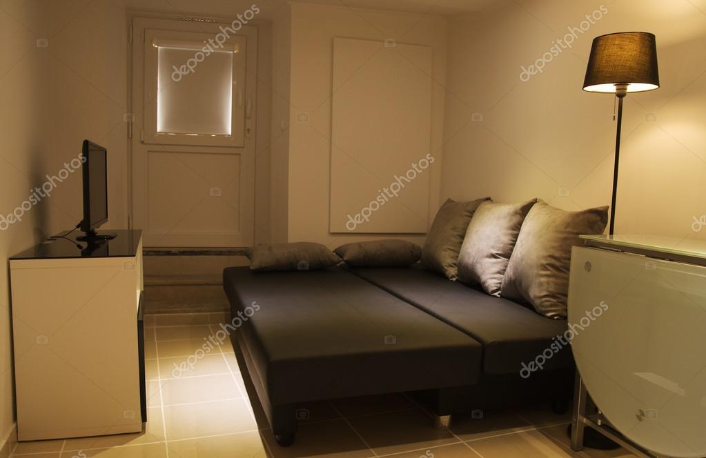 Small Living Room With Open Sofa Bed Stock Photo