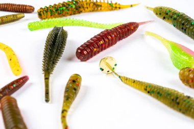 Jig silicone fishing lures isolated on a white background. Silicone fishing baits isolated. Colorful baits. Fishing spinning bait. Silicone soft plastic bait lure clipart