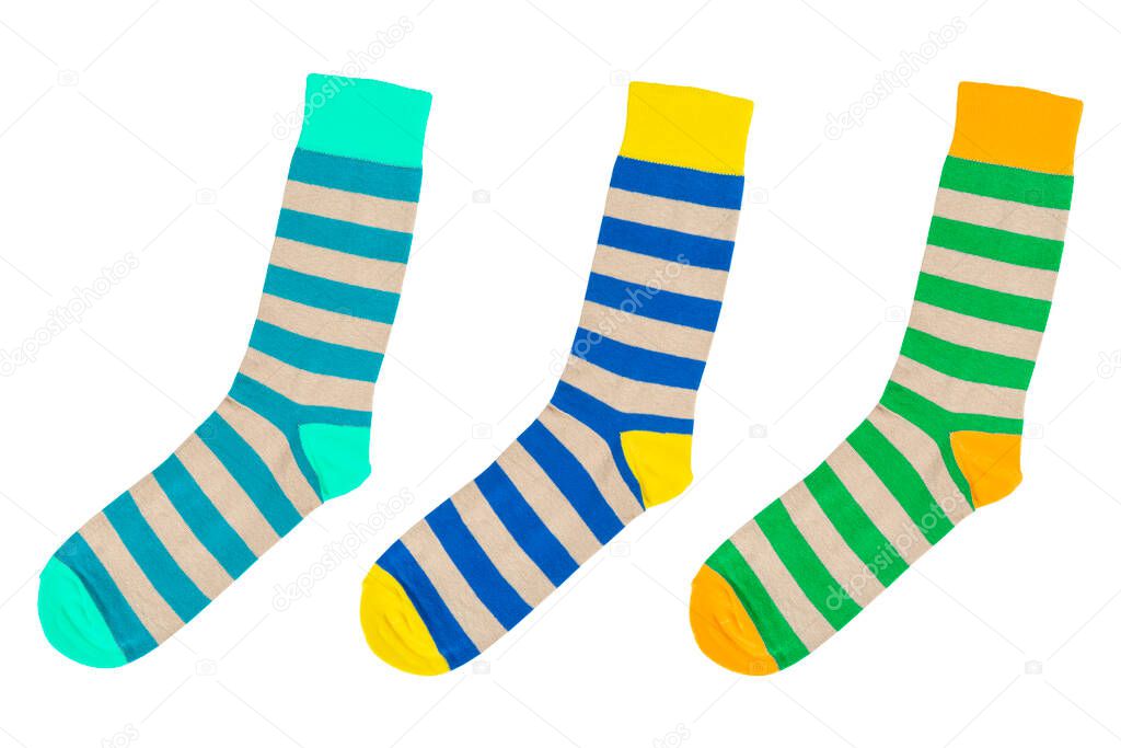 Three socks with different lines isolated on white background. Colorful socks son white background. Colored socks on the leg isolated on white background