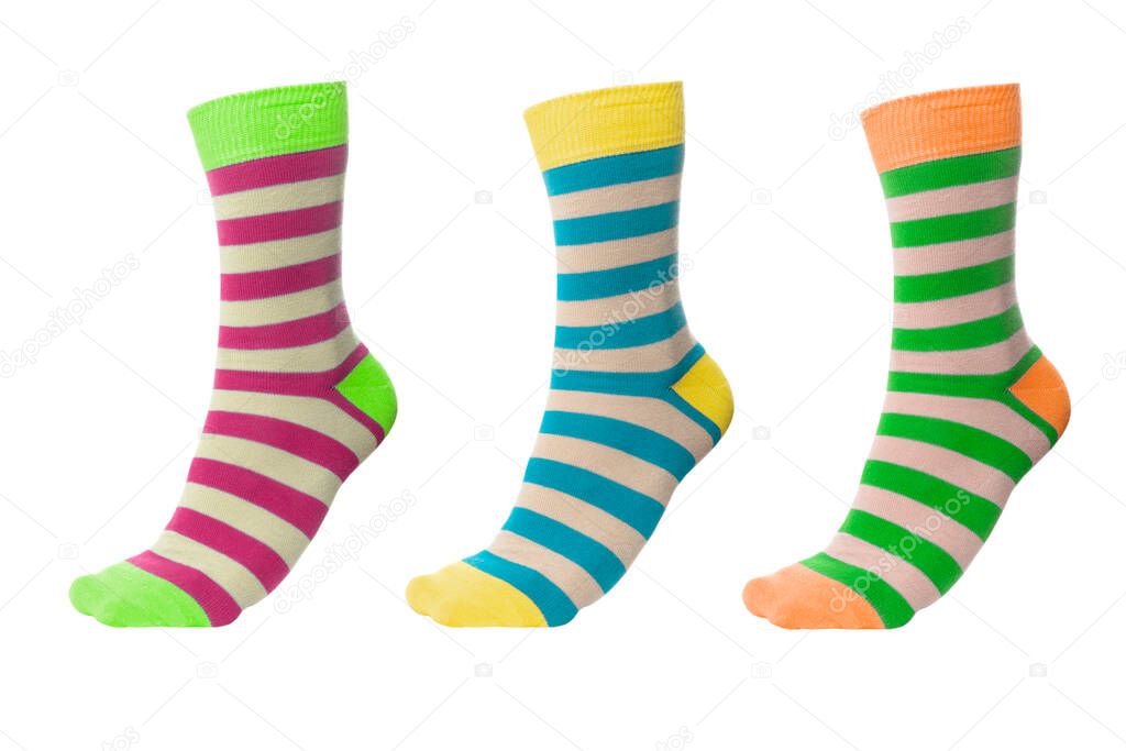 Three volumetric socks with different lines isolated on white background. Colorful volumetric socks on white background. Colored socks on the leg isolated on white background