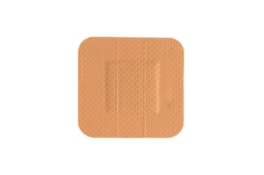 Üst görünüm tıbbi alçı beyaz arka planda izole edilmiş. Tıbbi yapışkan yama beyazda izole edilmiş. İlk yardım malzemesi. Yapışkan bandaj bandı.