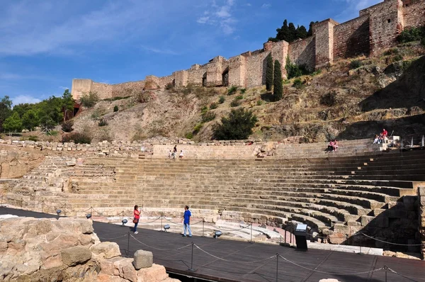 Tourist visiting ancient roman theatre on October 4, 2014 in Malaga, Spain — Stock Photo, Image