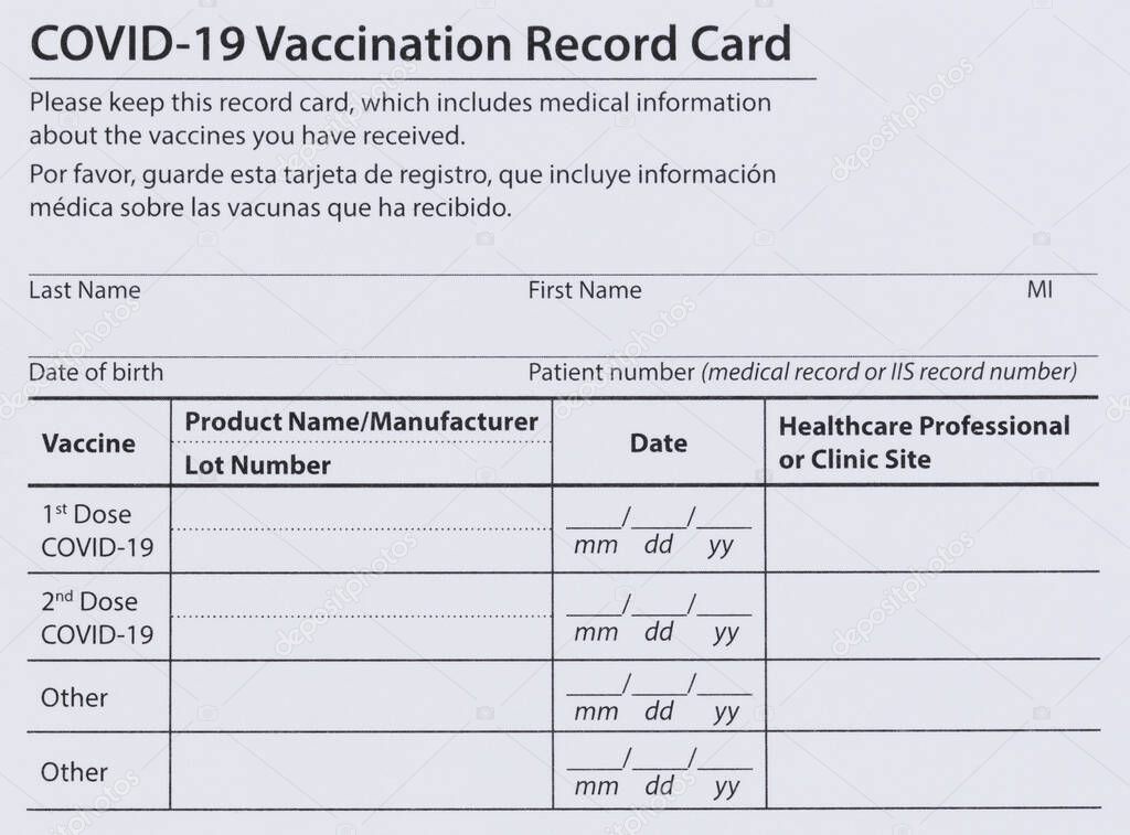 Covid 19 vaccination record card in both English and Spanish languages. Individual record for use during the covid 19 coronavirus global pandemic 