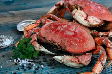 Freshly cooked crab with other ingredients in close up view for seafood background concept  