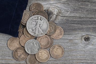 Bag of United States Rare Coins on Wood  clipart
