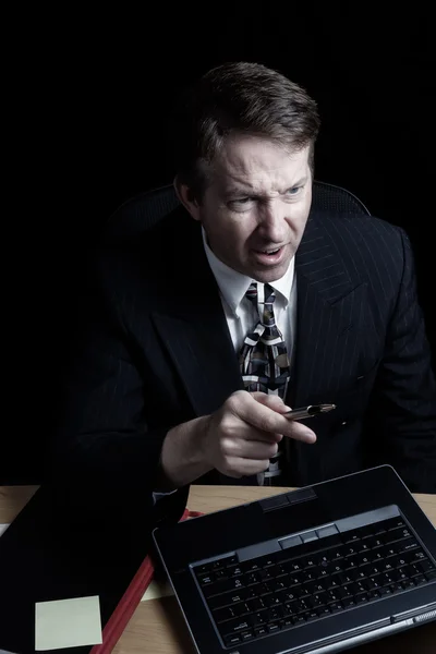 Businessman showing anger over data on computer — Stock Photo, Image