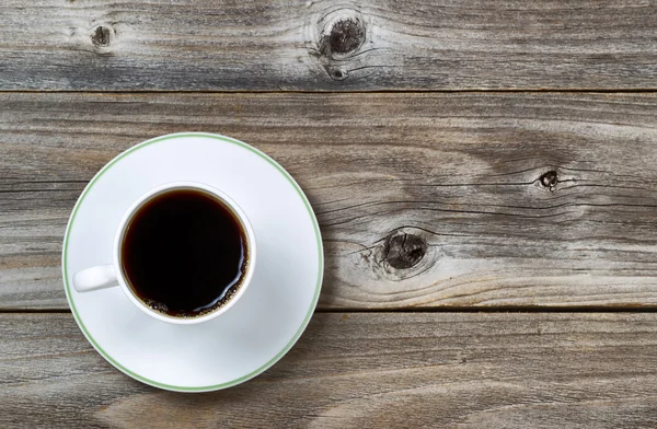 Fresh Coffee in Cup and saucer on aged wood — Stock Photo, Image