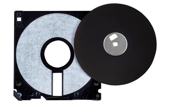 Inside parts of a computer diskette or floppy disk on white — Stock Photo, Image