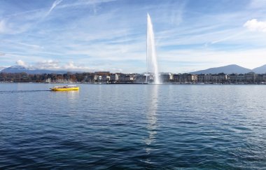Lake Geneva Switzerland with water fountain and water taxi on a  clipart