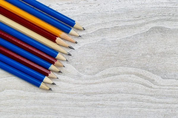 Pencil Tips forming Line on White Wood — Stock Photo, Image