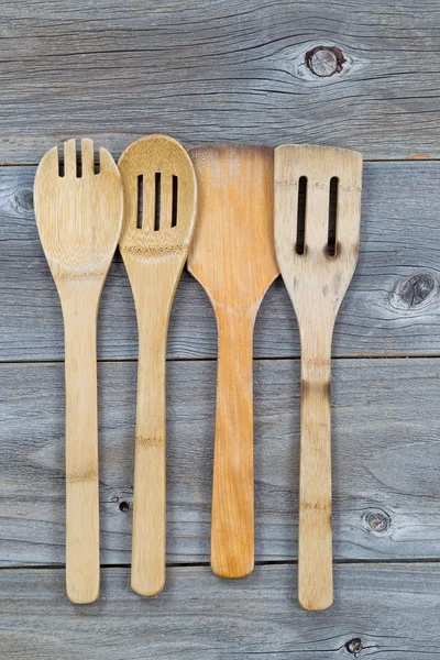 Used wooden cooking utensils on old wood — Stock Photo, Image