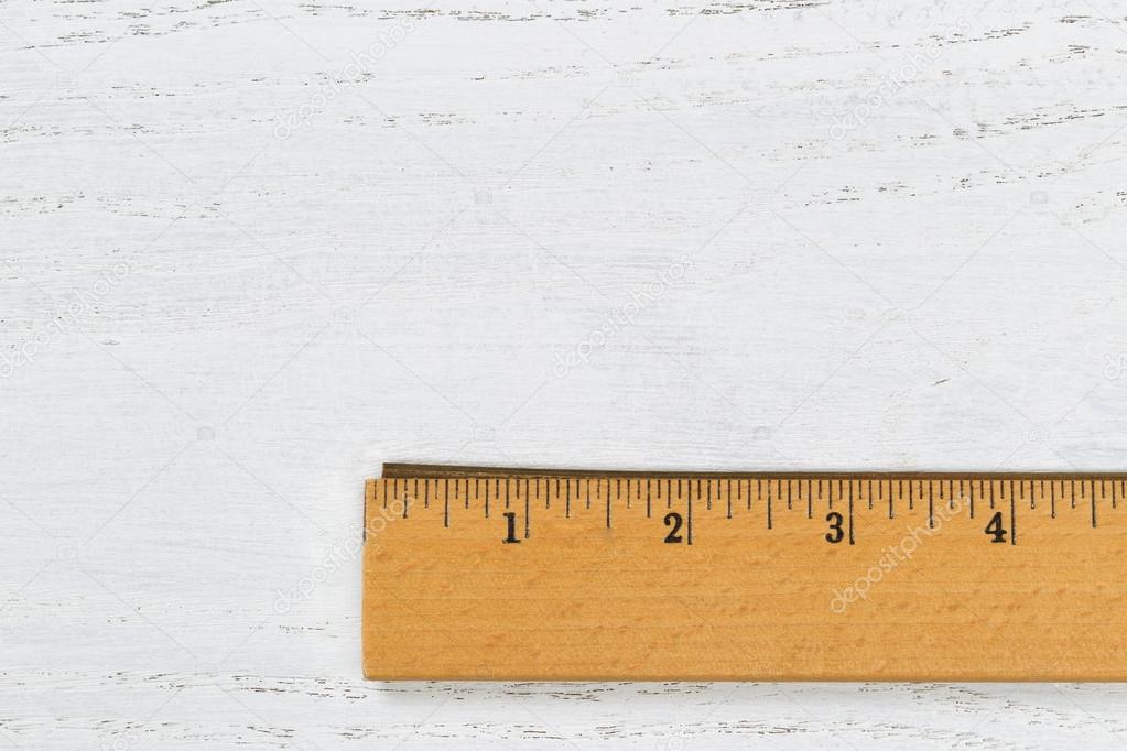 Wooden Ruler with Metal Edge on White wood 