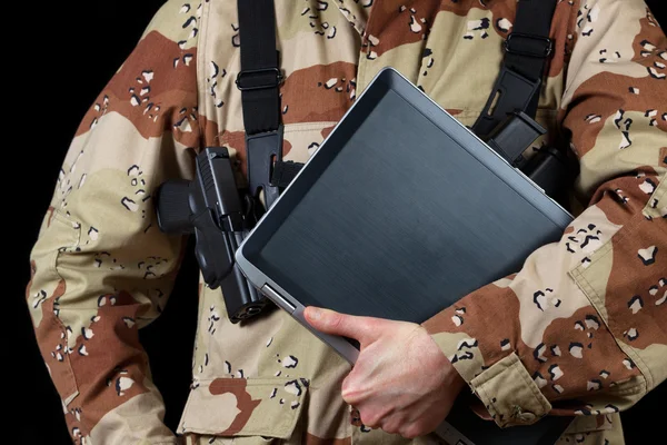 Armed soldier holding modern technology computer
