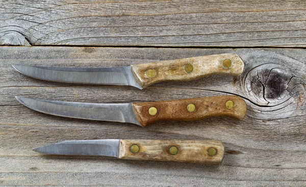 Vintage knives on rustic wood — Stock Photo, Image