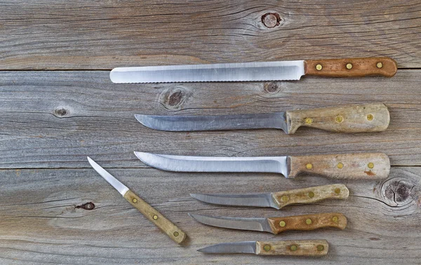 Vintage knives on rustic wood — Stock Photo, Image