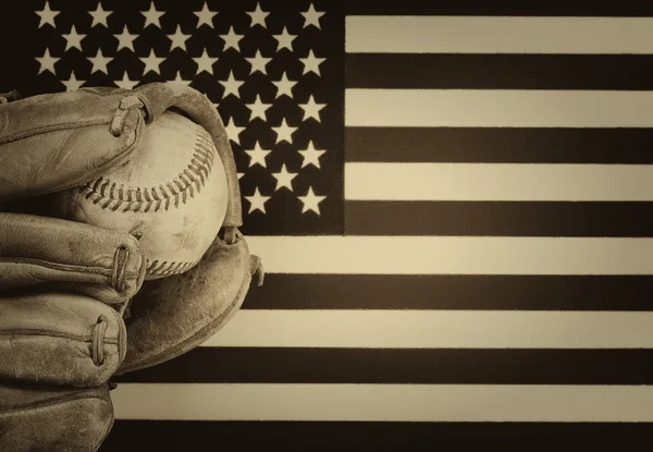 Worn baseball glove and used ball on American Flag — Stock Photo, Image