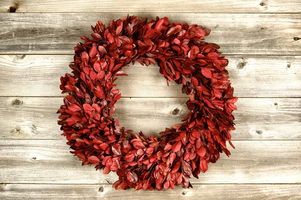 Red Wreath on vintage wood for the holidays — Stock Photo, Image