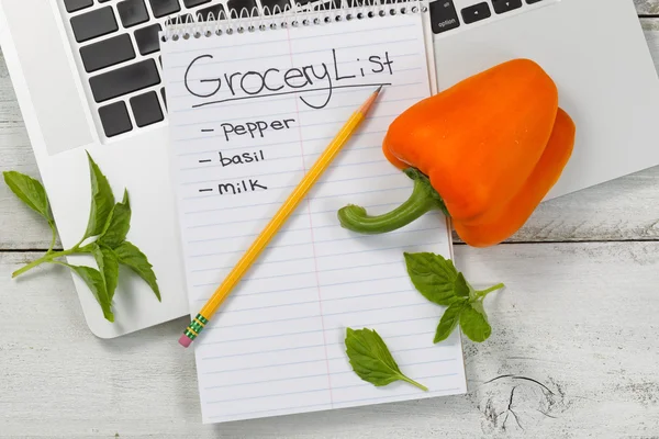 Grocery list for online shopping on desktop — Stok fotoğraf