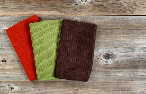 Colorful cleaning clothes on rustic wooden boards — ストック写真