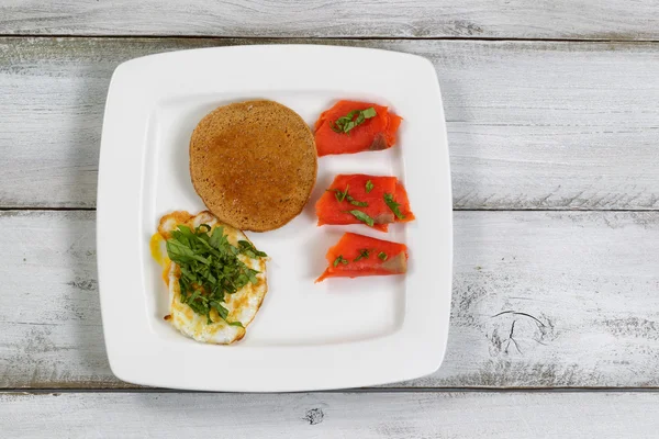 Gourmet breakfast on rustic wooden boards — Stock Photo, Image