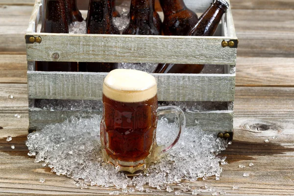 Cold dark beer in large glass mug with vintage crate with ice co — Stock Photo, Image