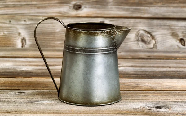 Vintage coffee pot on rustic wooden boards — Zdjęcie stockowe