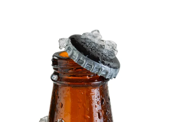 Close up view of an ice cold beer bottle neck and removed cap — Stock Photo, Image