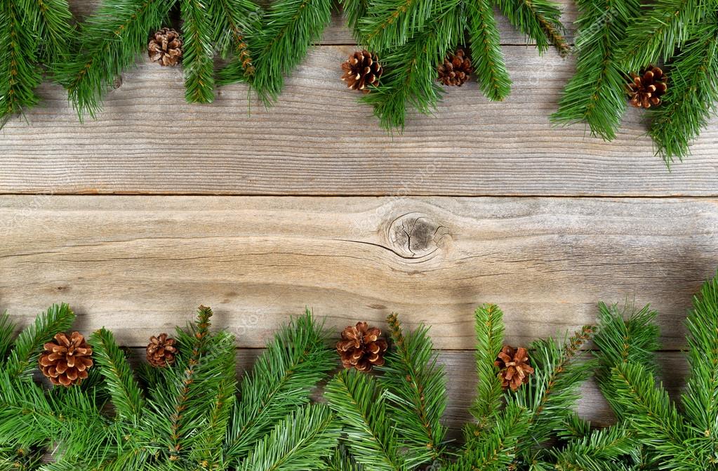 Christmas holiday border with evergreen branches on rustic cedar Stock  Photo by ©tab62 78314884