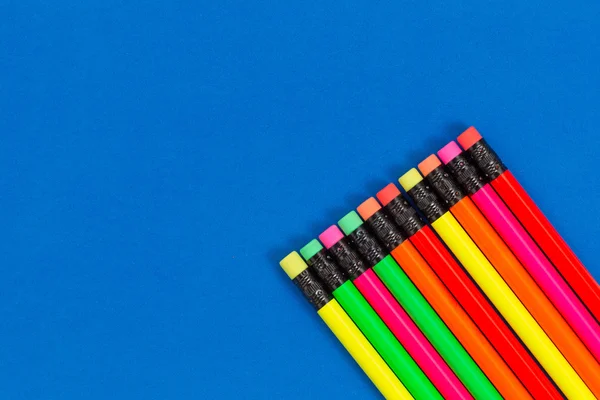 Colorful pencils on blue background — Stock Photo, Image