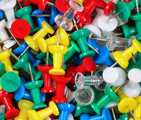 Filled frame of thumbtacks in different colors — Stock Photo, Image