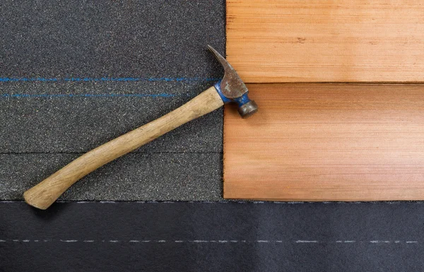 Used roofing hammer with new shingles of composite and cedar woo — Stock Photo, Image