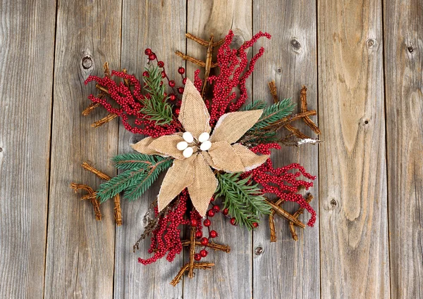 Christmas wreath with cloth flower on rustic wooden boards — Stock Photo, Image