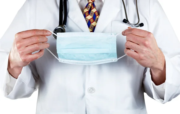 Medical doctor holding surgical mask in hands — Stock Photo, Image