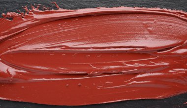 Koyu arkaplanda boya dokusu.