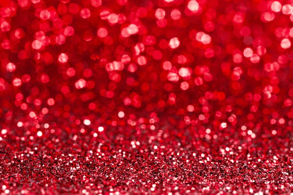 光沢のある赤いボケの輝きライト抽象的な背景 クリスマスの新年バレンタインパーティーのお祝いのコンセプト — ストック写真