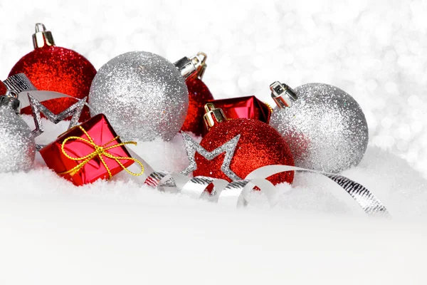 Christmas decorations in snow — Stock Photo, Image