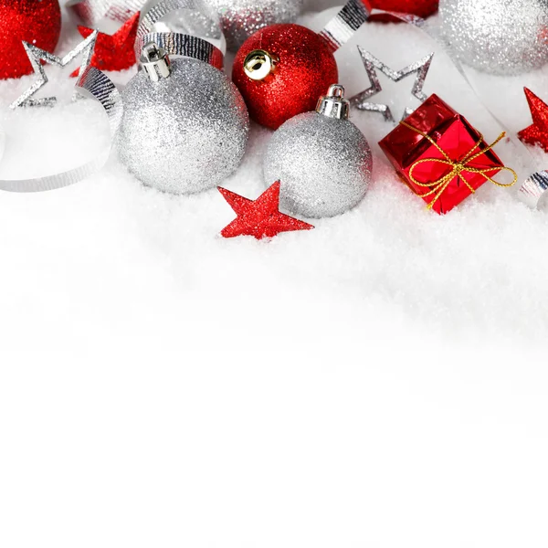 Christmas decorations in snow — Stock Photo, Image