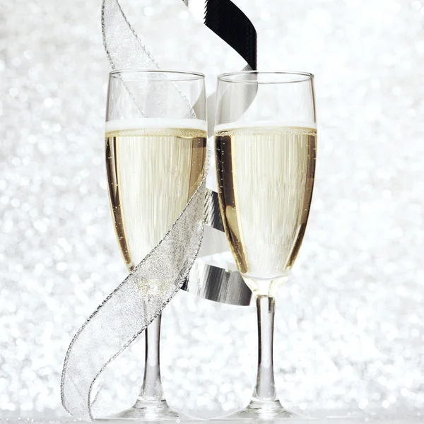 Champagne och rosett — Stockfoto