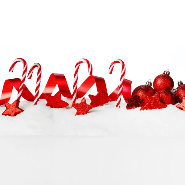 Christmas decorations in snow — Stock Photo, Image