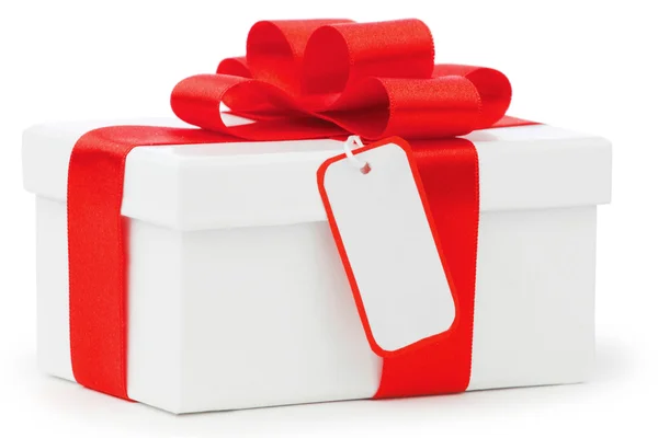 Fehér ajándék doboz piros szalaggal íj — Stock Fotó